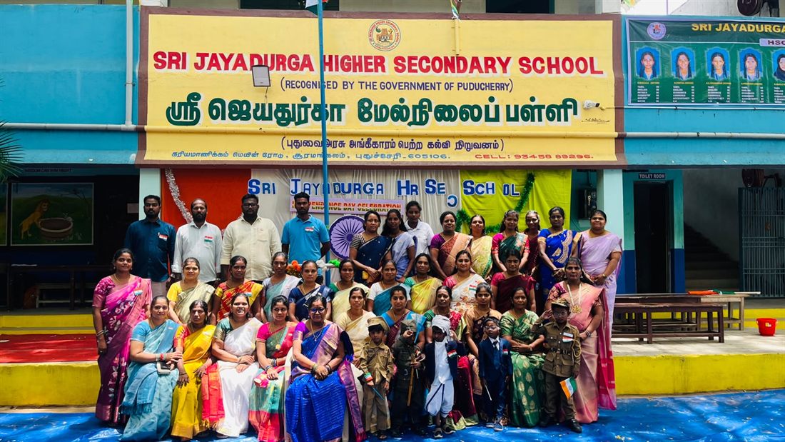 The teaching staff gathered in front of the school