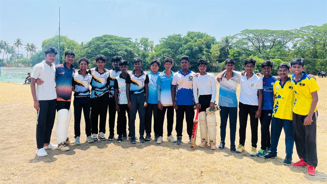 The cricket squad lined up on the field in their playing colours